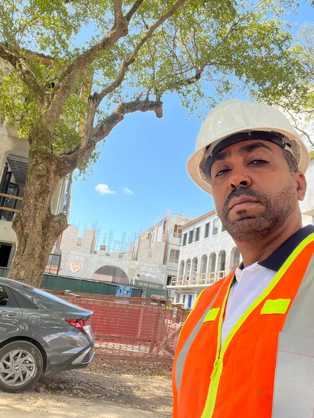 Ernesto Herrera on-site with safety equipment at a construction project